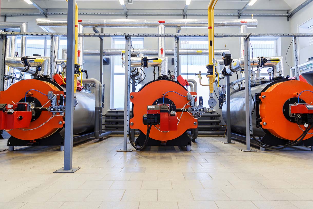 Industry automatical boiler gas burners. Interior of modern boiler house.